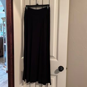 Black skirt, with slight gathering at waist, Excellent condition.  Very elegant.